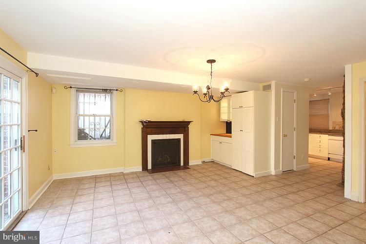 1214 Portner Road Alexandria, VA 22314 - Photo 12 of 21 a view of a hallway with a chandelier fan and windows