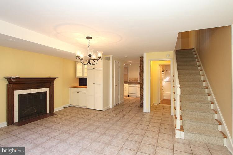 1214 Portner Road Alexandria, VA 22314 - Photo 16 of 21 a view of a kitchen with a sink and a fireplace