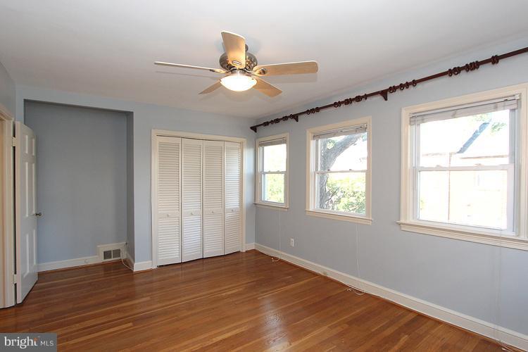 1214 Portner Road Alexandria, VA 22314 - Photo 18 of 21 a view of an empty room with wooden floor and a window