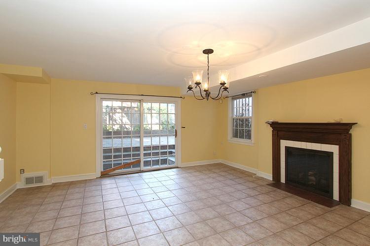 1214 Portner Road Alexandria, VA 22314 - Photo 7 of 21 an empty room with windows and fireplace
