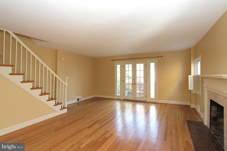 1214 Portner Road Alexandria, VA 22314 - Photo 10 of 21 a view of an empty room with wooden floor and a window