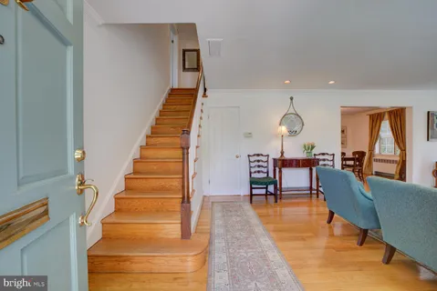 a view of dining room and hall with furniture