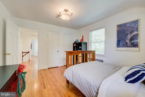 a bed room with a bed and a chandelier