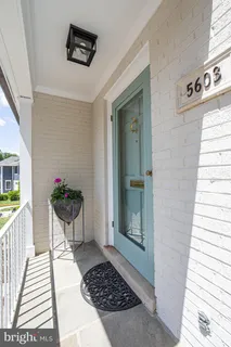 a view of a entryway door with wooden floor