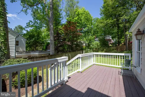 a view of balcony with deck and trees
