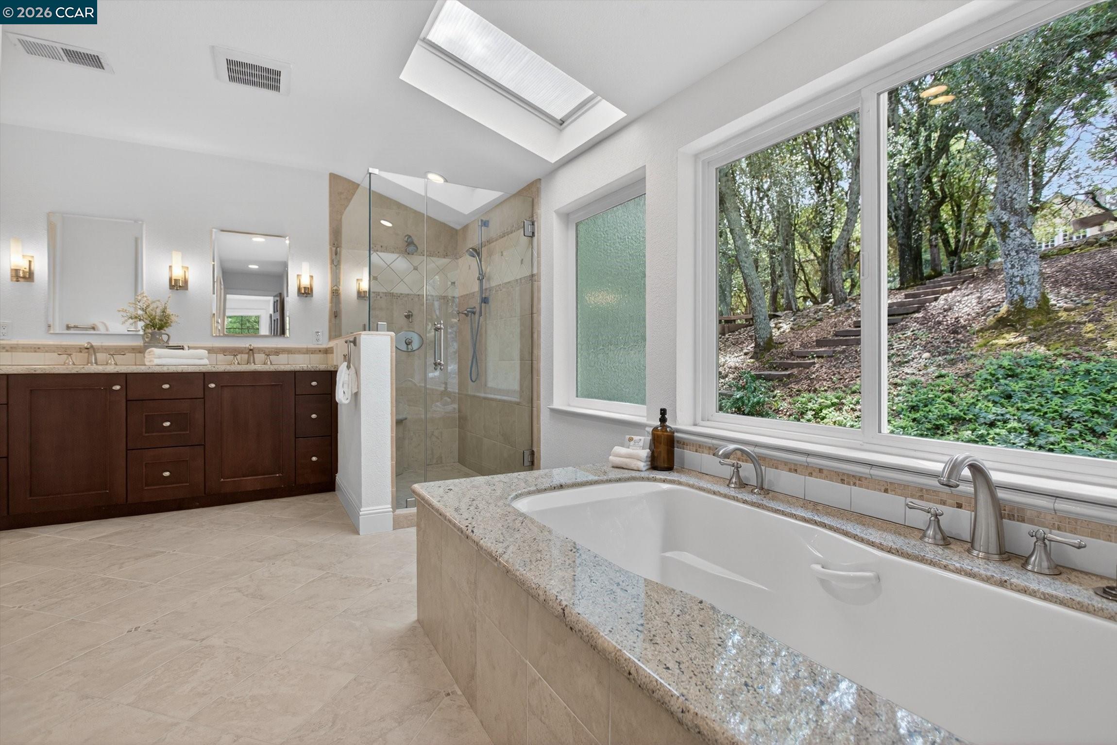 4105 Coralee Lane Lafayette, CA 94549 - Photo 28 of 43 a spacious bathroom with a tub sink and mirror