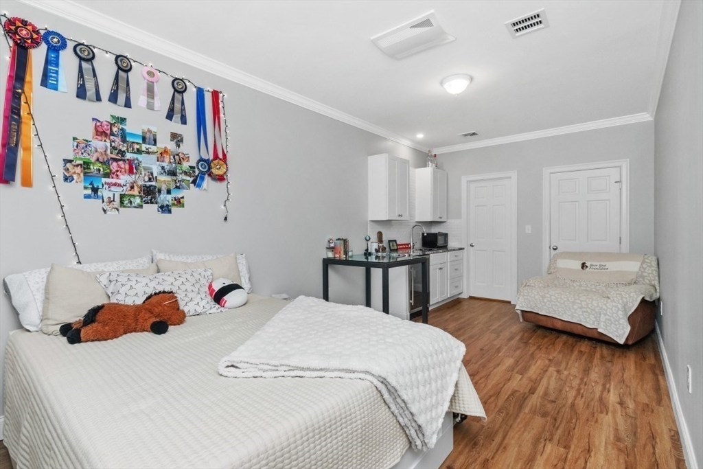 20 College Farm Road Waltham, MA 02451 - Photo 21 of 32 a bed room with a bed and a couch