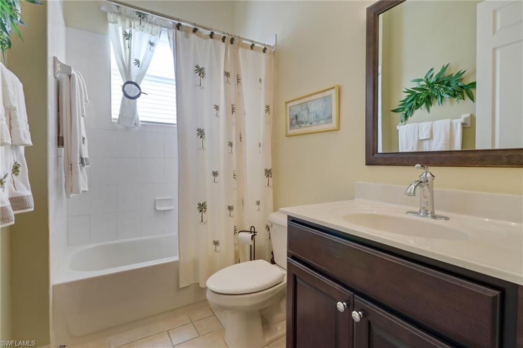 9312 Sun River Way Estero, FL 33928 - Photo 16 of 45 a bathroom with a sink a toilet and shower