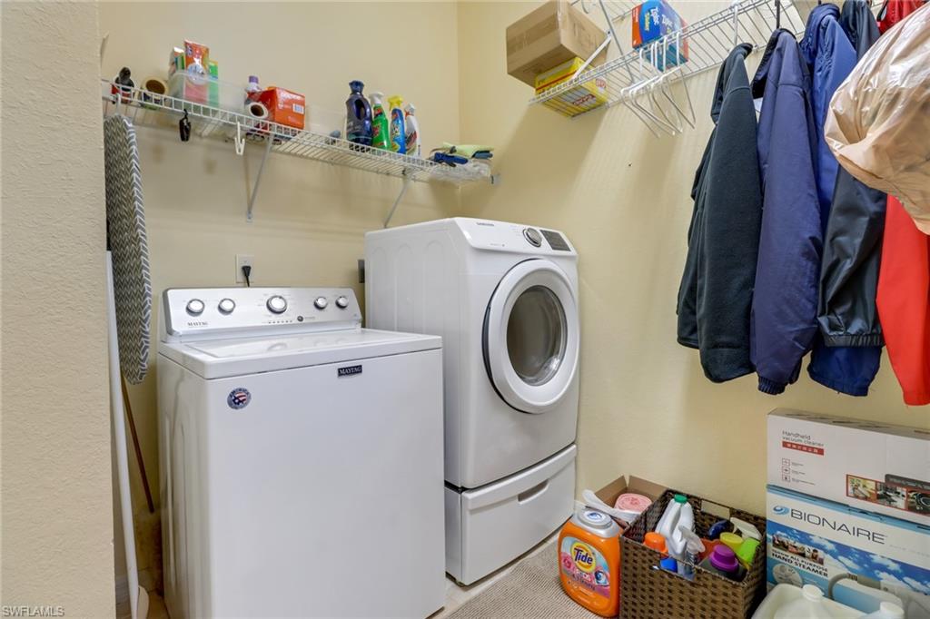9312 Sun River Way Estero, FL 33928 - Photo 22 of 45 a utility room with dryer and washer