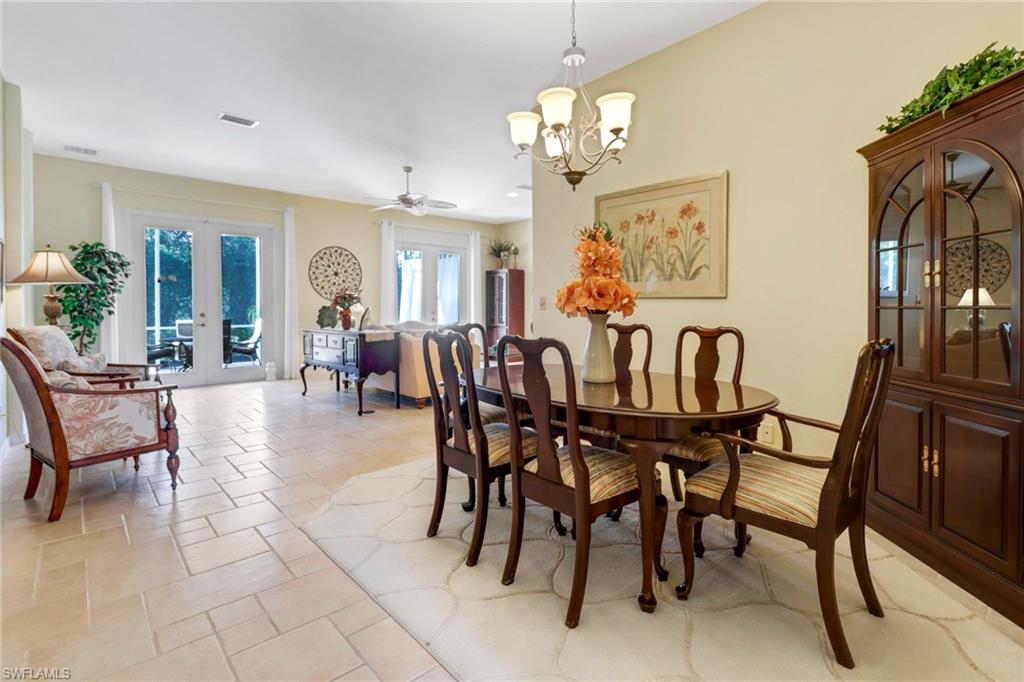9312 Sun River Way Estero, FL 33928 - Photo 5 of 45 a dining room with furniture a livingroom and chandelier