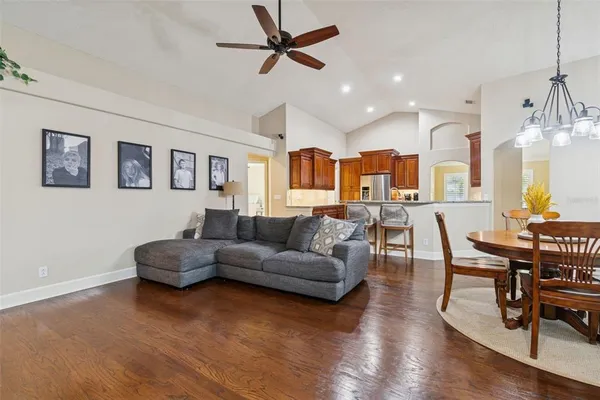 a view of a dining room with furniture and wooden floor