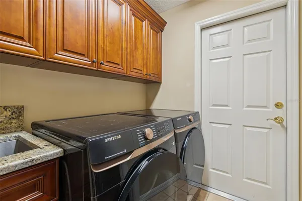 a bedroom with a bed and a flat tv screen
