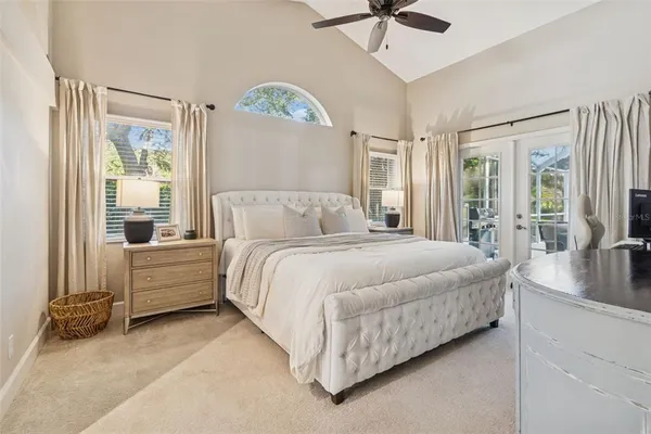 a bedroom with a bed and a lamp