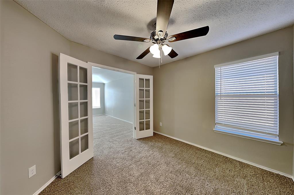 3304 Athens Drive Corinth, TX 76210 - Photo 16 of 22 a view of an empty room with a window
