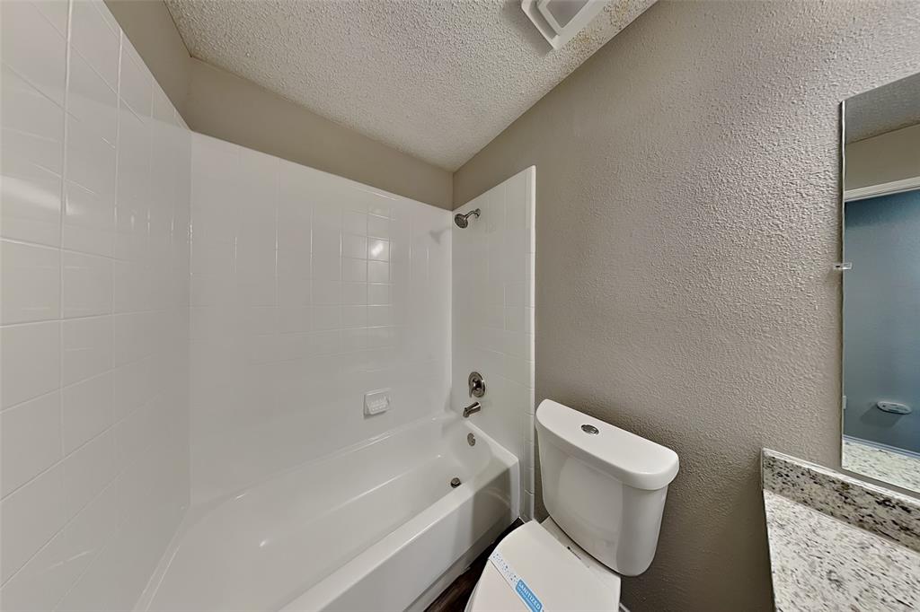 3304 Athens Drive Corinth, TX 76210 - Photo 19 of 22 a white toilet sitting next to a bath tub
