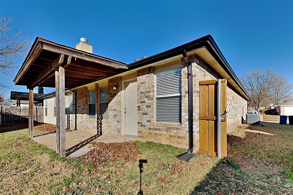 3304 Athens Drive Corinth, TX 76210 - Photo 20 of 22 a view of a house with a small yard