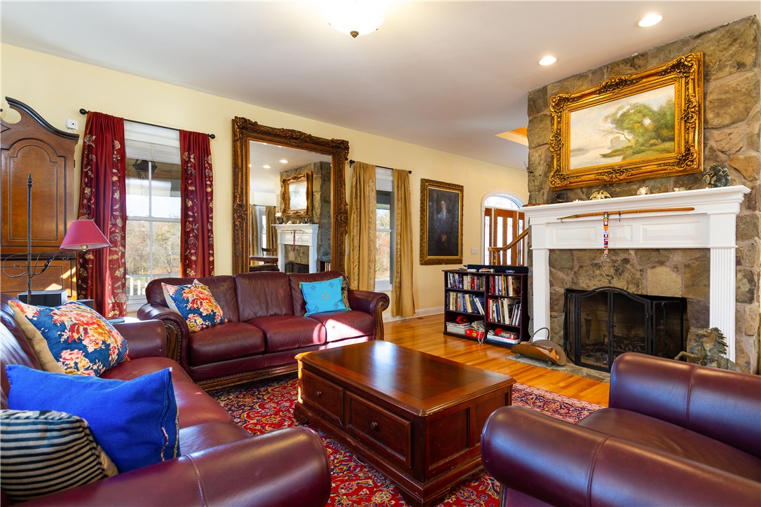 1 Ocean Heights Road Newport, RI 02840 - Photo 12 of 34 Living room with great stone wood burning fireplace.
