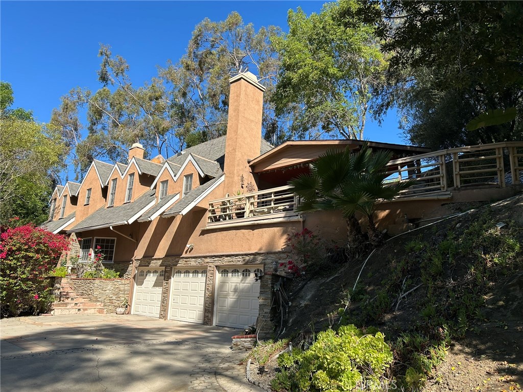 300 South Timken Road Anaheim, CA 92808 - Photo 1 of 40 a front view of a house with a garden