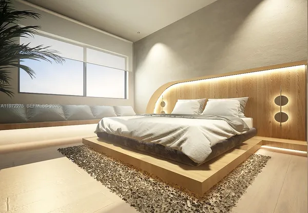 a spacious bedroom with a bed and a couch