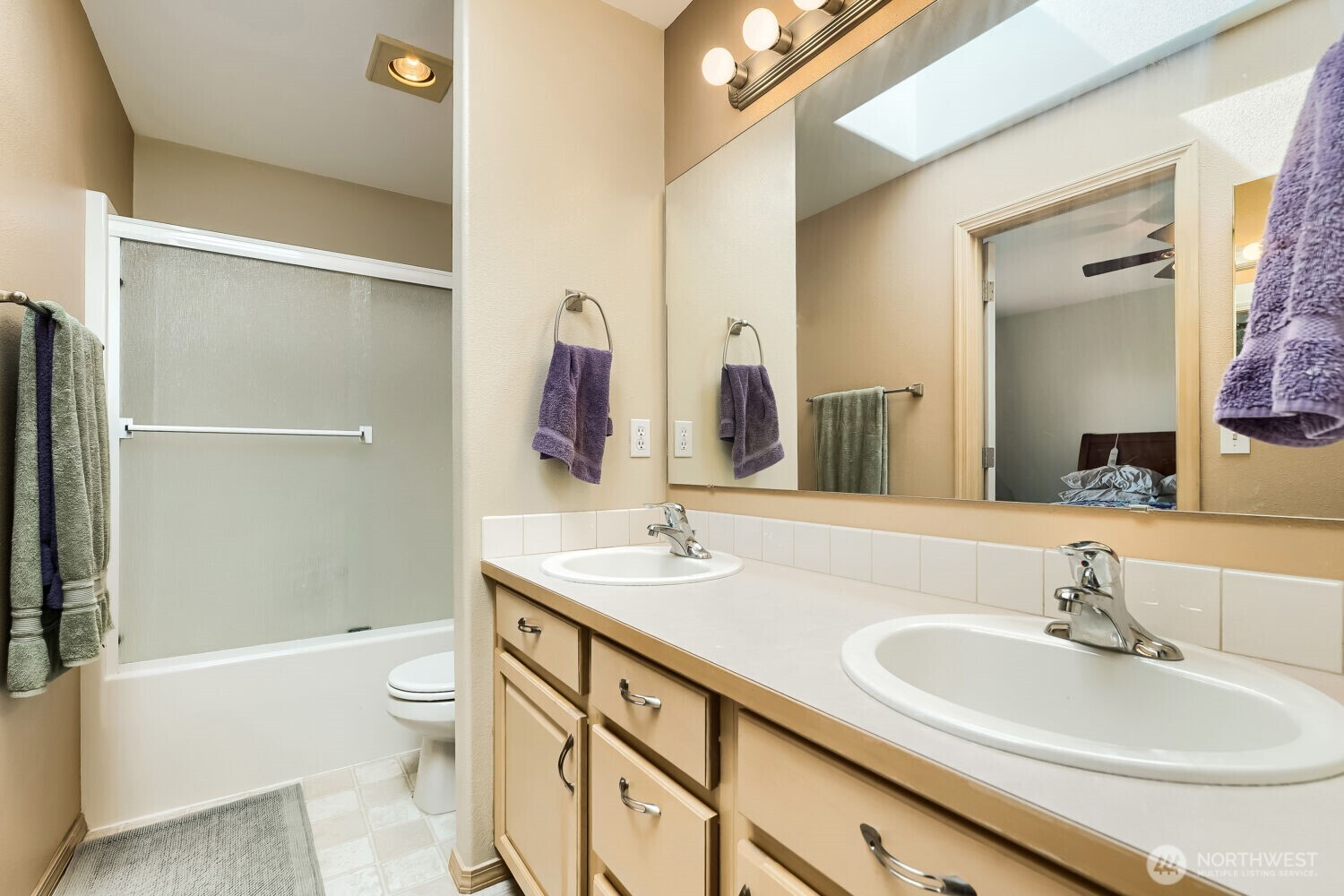1008 R Street Northwest Auburn, WA 98001 - Photo 15 of 32 a bathroom with a sink a toilet and shower