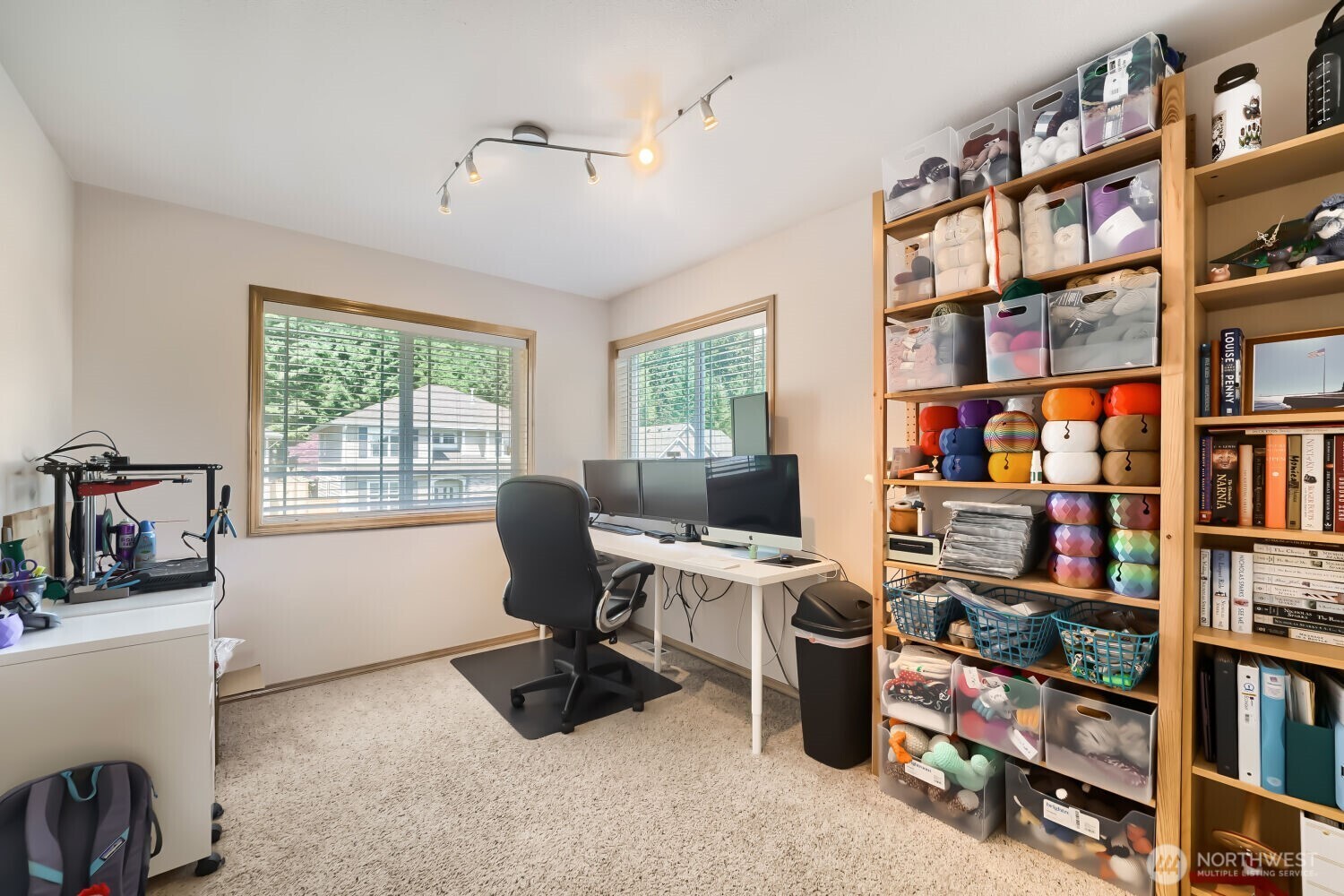 1008 R Street Northwest Auburn, WA 98001 - Photo 18 of 32 a view of a workspace with bookshelf and a window