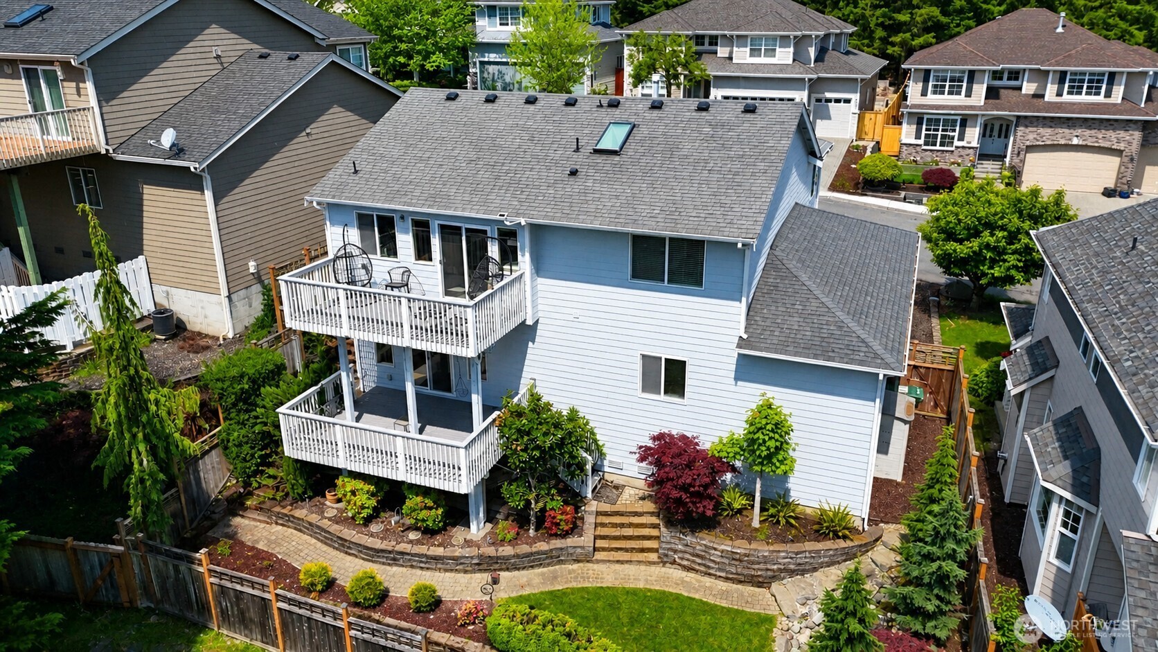 1008 R Street Northwest Auburn, WA 98001 - Photo 6 of 32 a aerial view of a house with a yard and potted plants