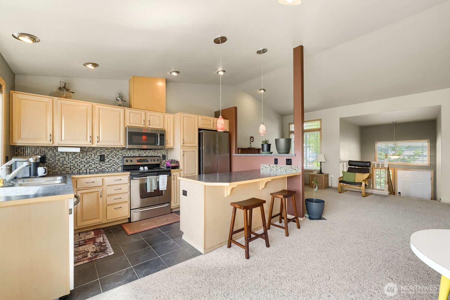 1008 R Street Northwest Auburn, WA 98001 - Photo 9 of 32 a kitchen with white cabinets and stainless steel appliances