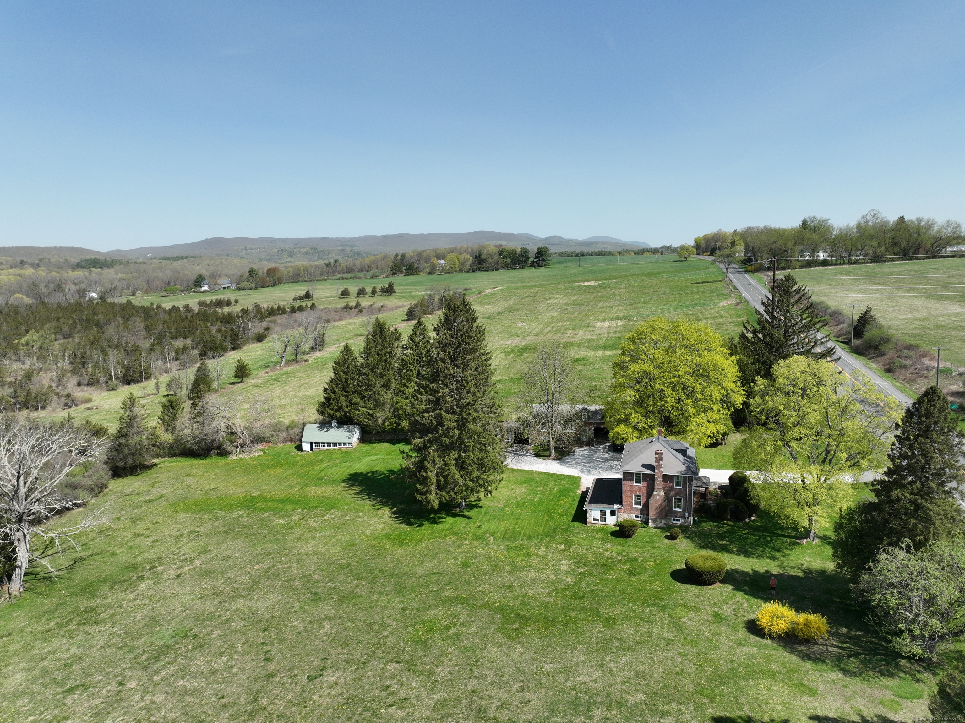 400 Gay Street Sharon, CT 06069 - Photo 6 of 8 an aerial view of green landscape with trees houses and mountain view