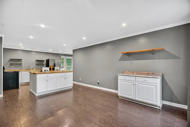 a kitchen with a stove and a refrigerator