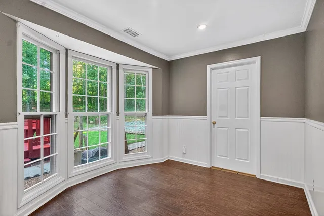 a view of kitchen with furniture and wooden floor