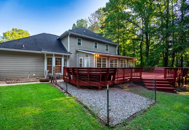 a view of a house with a yard porch and sitting area