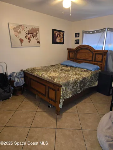 a bedroom with a bed and a cabinets