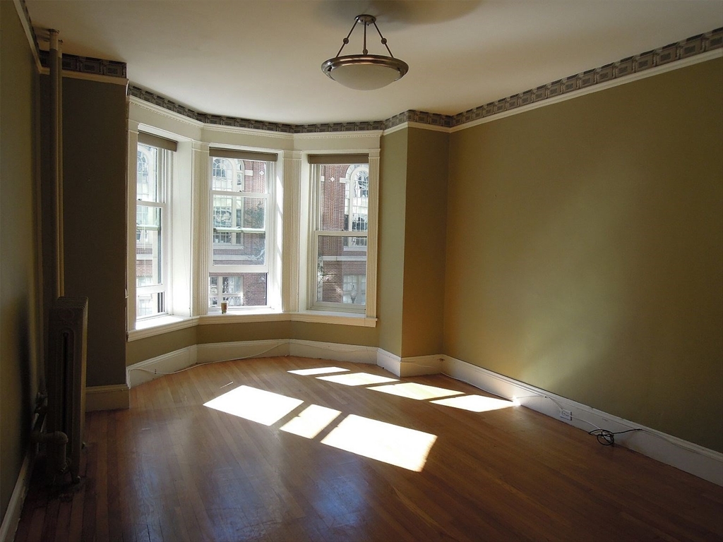 8 Garrison Street, Unit 209 Boston, MA 02116 - Photo 23 of 33 a view of livingroom with hardwood floor and window
