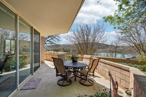 a view of a swimming pool with a patio
