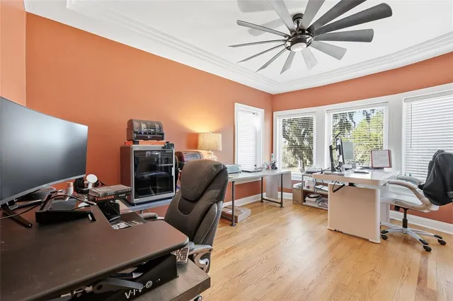 a view of a house with swimming pool and sitting area