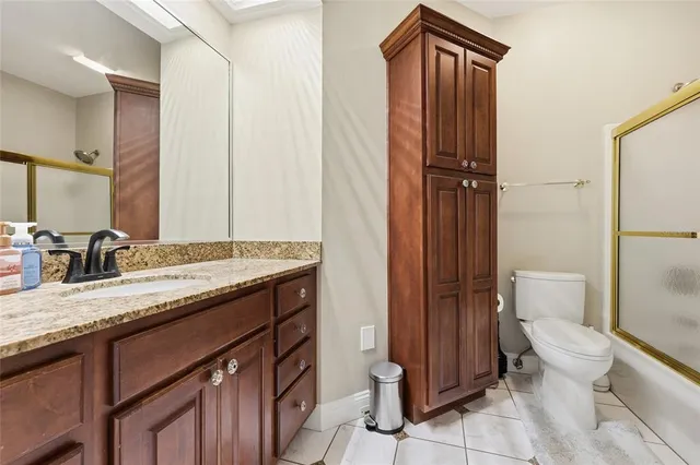 a view of a house with swimming pool and sitting area