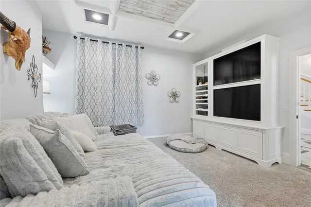 a bedroom with a bed and fireplace