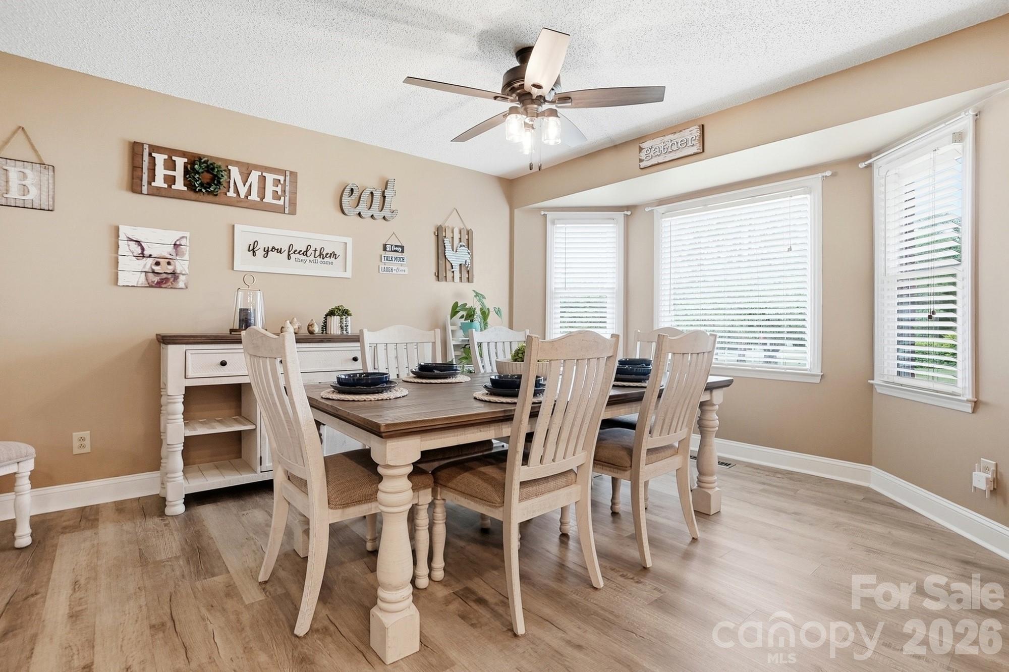 4017 Mullis Newsome Road Monroe, NC 28110 - Photo 20 of 38 a view of a dining room with furniture window and wooden floor