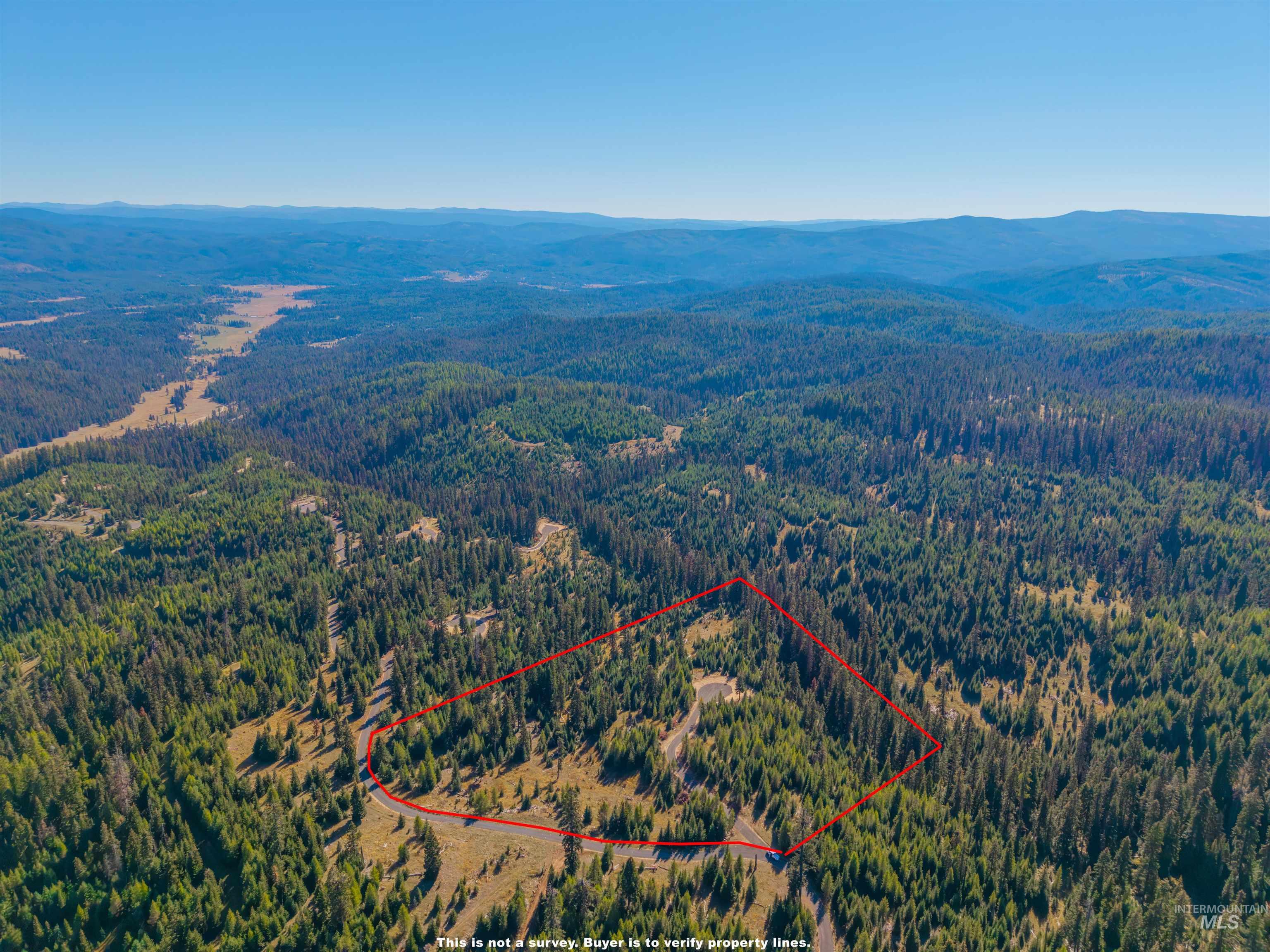 3 Tree Farm Trails Road Elk City, ID 83525 - Photo 8 of 17 Aerial view of property's location with a mountain backdrop and property parcel outlined