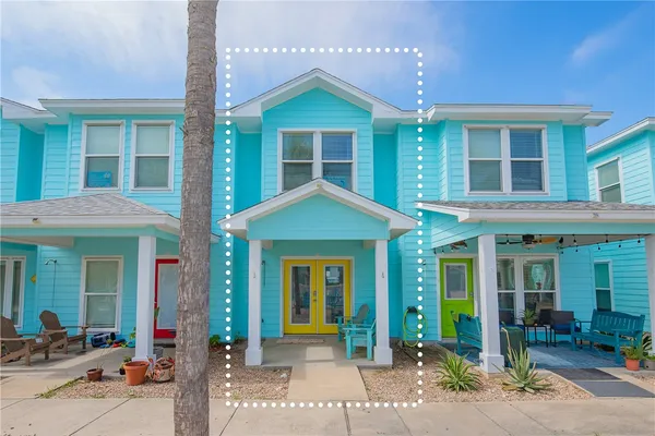 front view of a brick house with a large windows