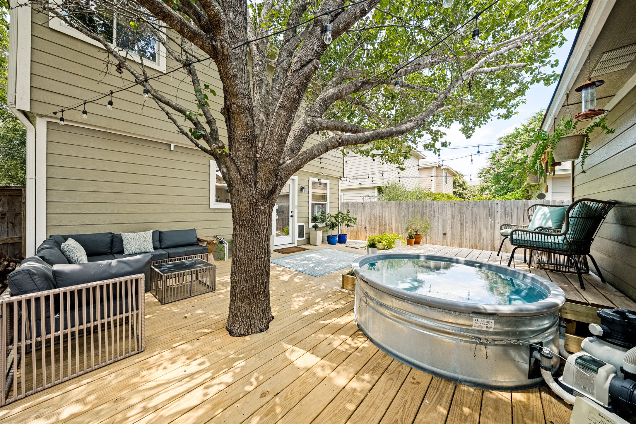 9205 Rowlands Sayle Road Austin, TX 78744 - Photo 23 of 25 A spacious wooden deck provides ample room for both lounging and a refreshing dip in the above-ground pool.