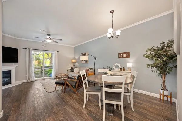 a view of a dining room with furniture window and wooden floor
