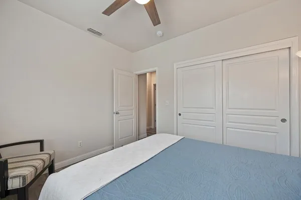 a bedroom with a bed and closet