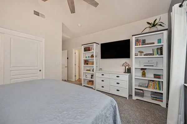 a bathroom with a granite countertop sink mirror and shower