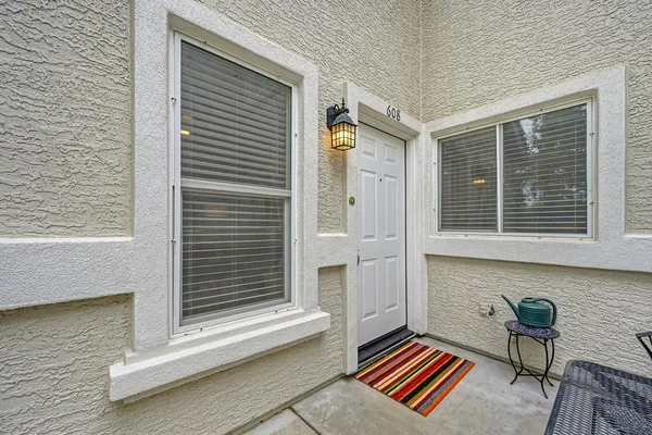 a backyard of a house with a lounge chair