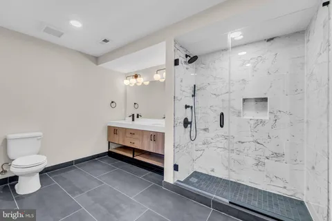 a bathroom with a sink a mirror and vanity