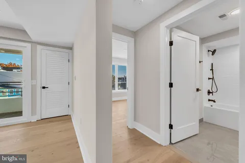 a bathroom with a sink a mirror and a bathtub