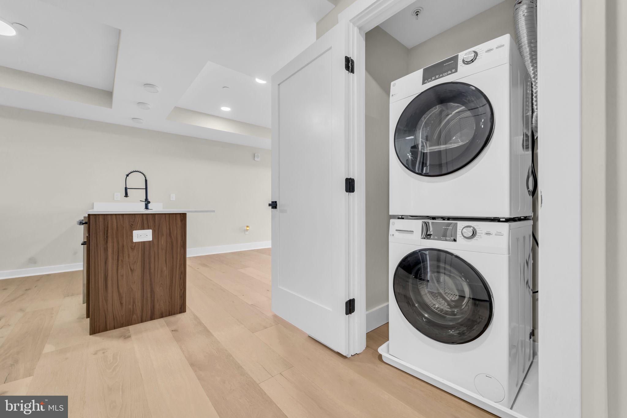 919 12th Street Northeast, Unit A303 Washington, DC 20002 - Photo 32 of 45 a view of a hallway with washer and dryer