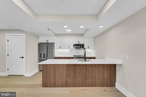 a view of a hallway with washer and dryer