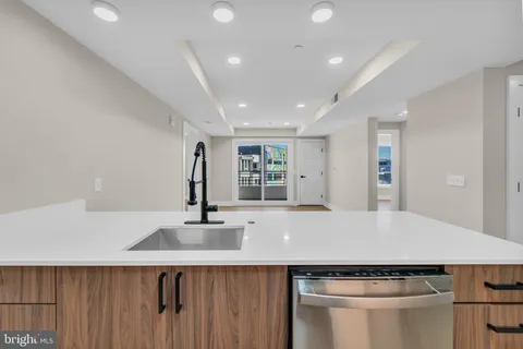 a kitchen with a sink and cabinets
